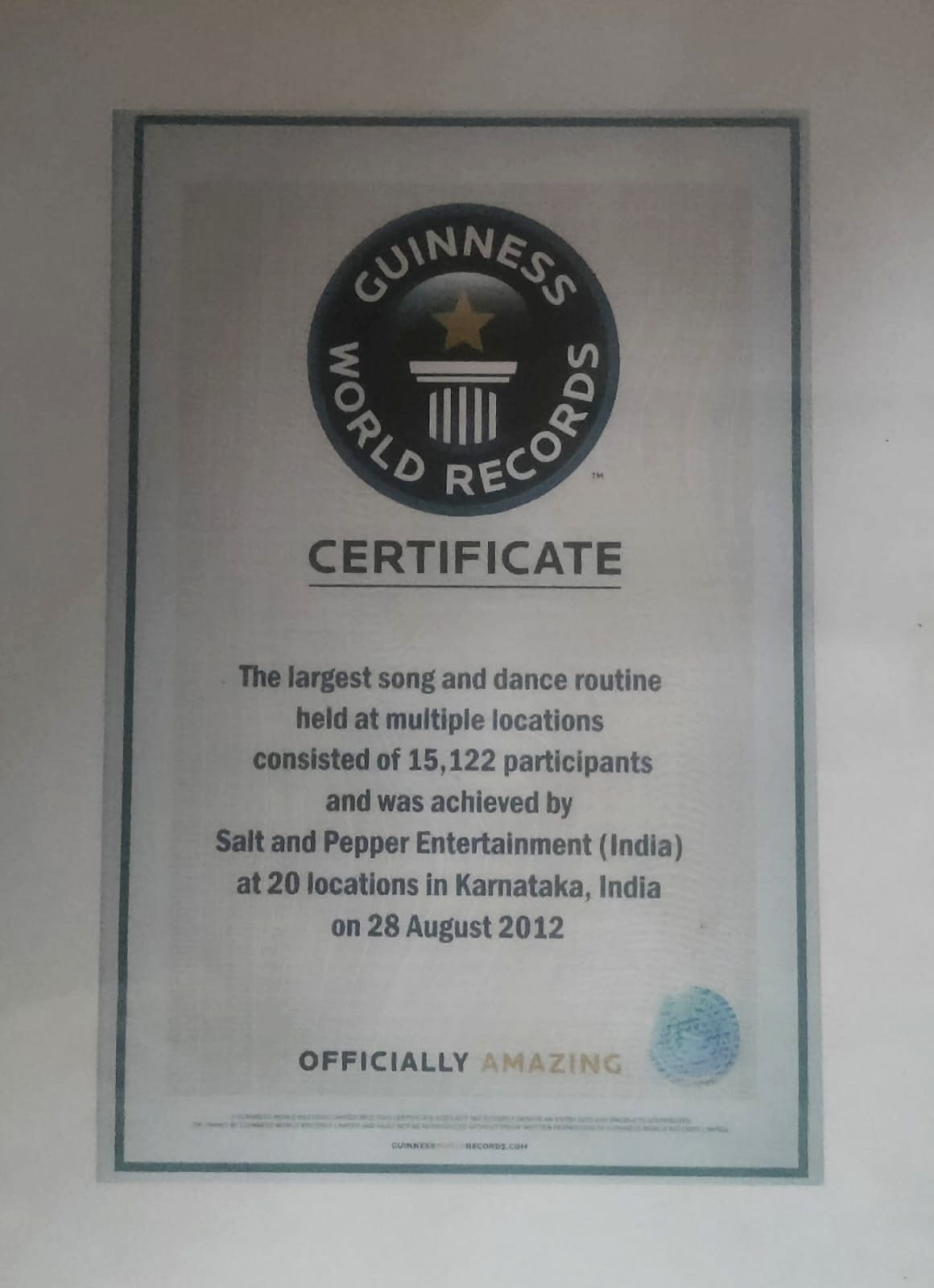 Guinness World Records certificate for the largest song and dance routine held at multiple locations, 28 August 2012